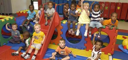 Children playing in a colorful indoor playroom